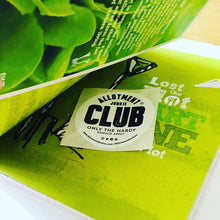 Load image into Gallery viewer, Inside shot of first page of the allotment growing guide by allotment junkie with round allotment club sticker